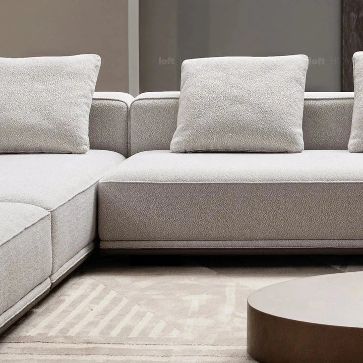 Minimalist mixed weave fabric modular ottoman eleganza l with context.