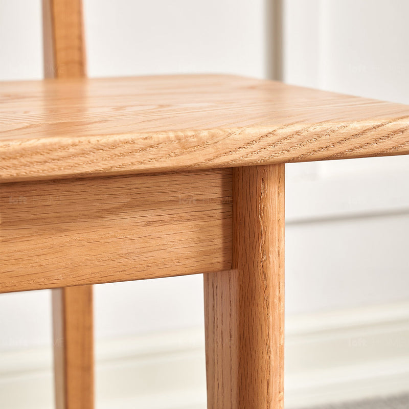 Scandinavian oak wood dining bench with backrest restly in still life.