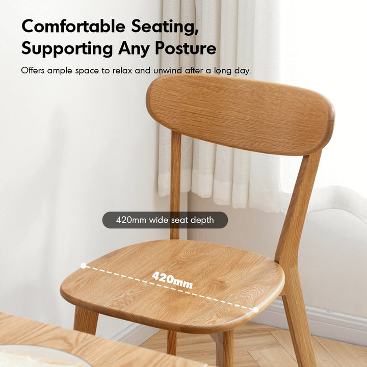 Scandinavian oak wood dining chair elm in close up details.