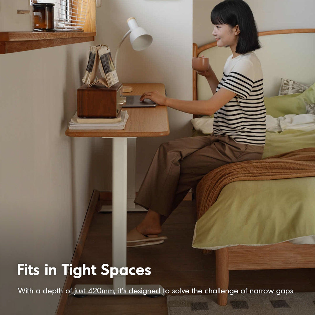 Scandinavian oak wood electric height adjustable slim study table slimlift in real life style.