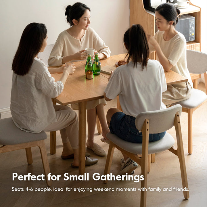 Scandinavian oak wood extendable dining table privot in still life.