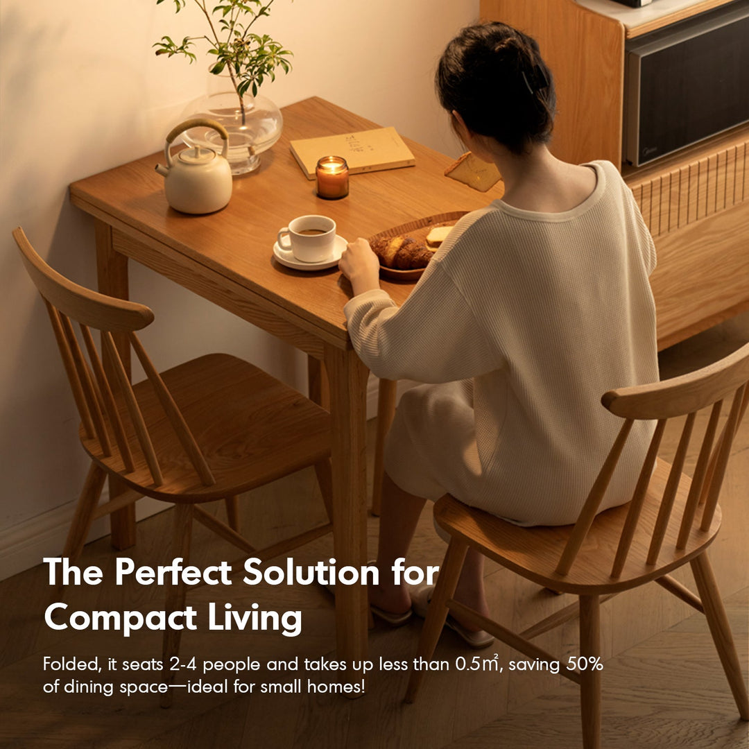 Scandinavian oak wood extendable dining table privot in close up details.