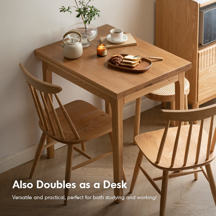 Scandinavian oak wood extendable dining table privot in panoramic view.