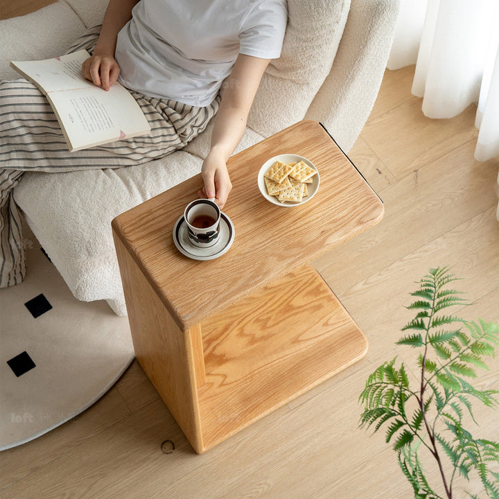 Scandinavian oak wood multi functional side table cshape in panoramic view.