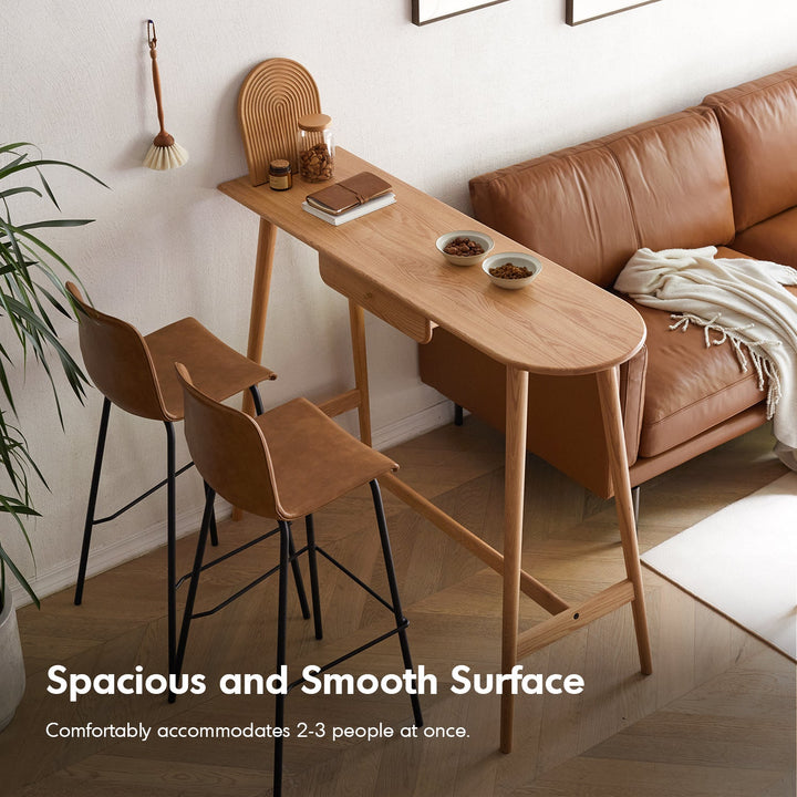 Scandinavian oak wood oval bar table arc in panoramic view.