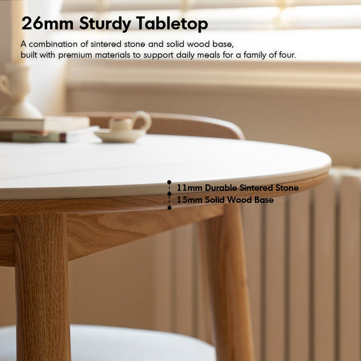 Scandinavian oak wood sintered stone round dining table orb in still life.