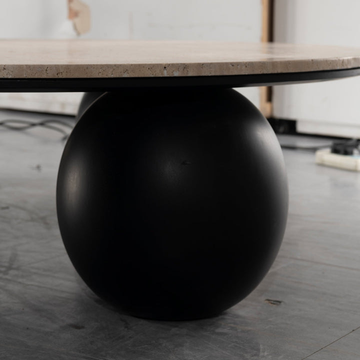 Japandi travertine stone coffee table muckety in details.