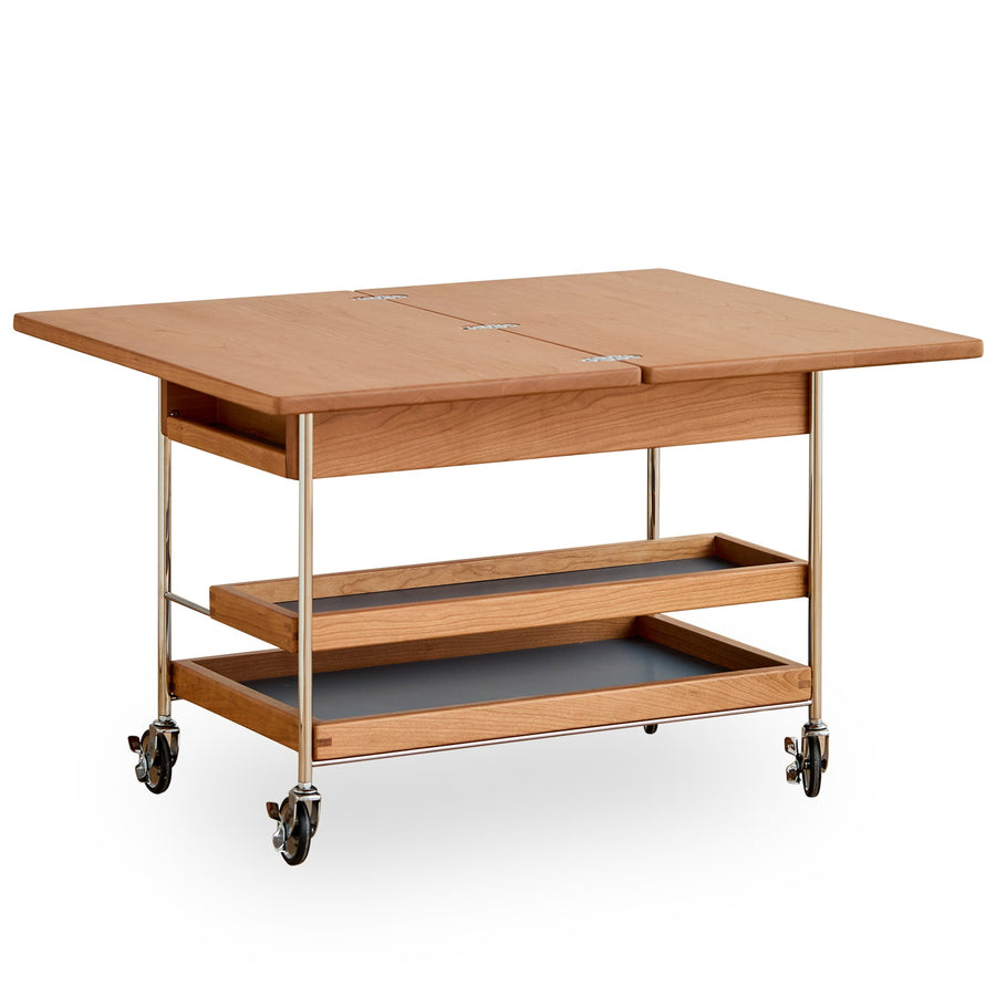 Scandinavian cherry wood extendable coffee table timeless in white background.