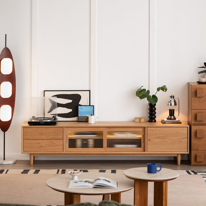 Scandinavian cherry wood tv console green in close up details.