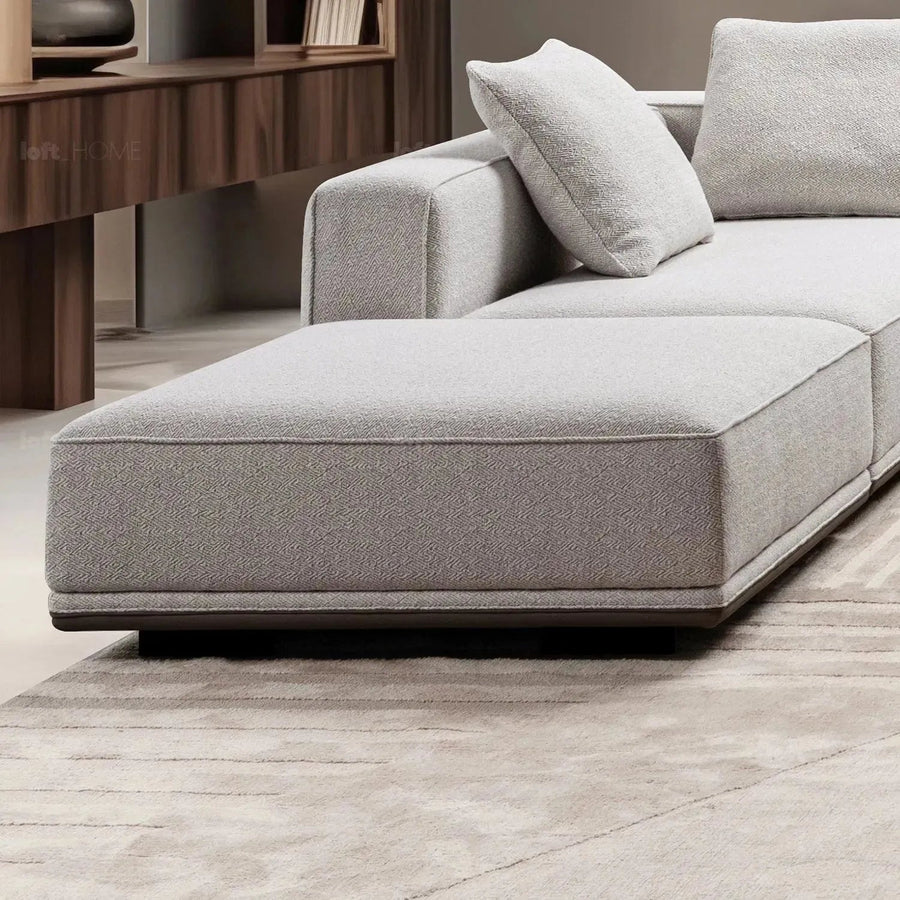 Minimalist mixed weave fabric modular ottoman eleganza in real life style.