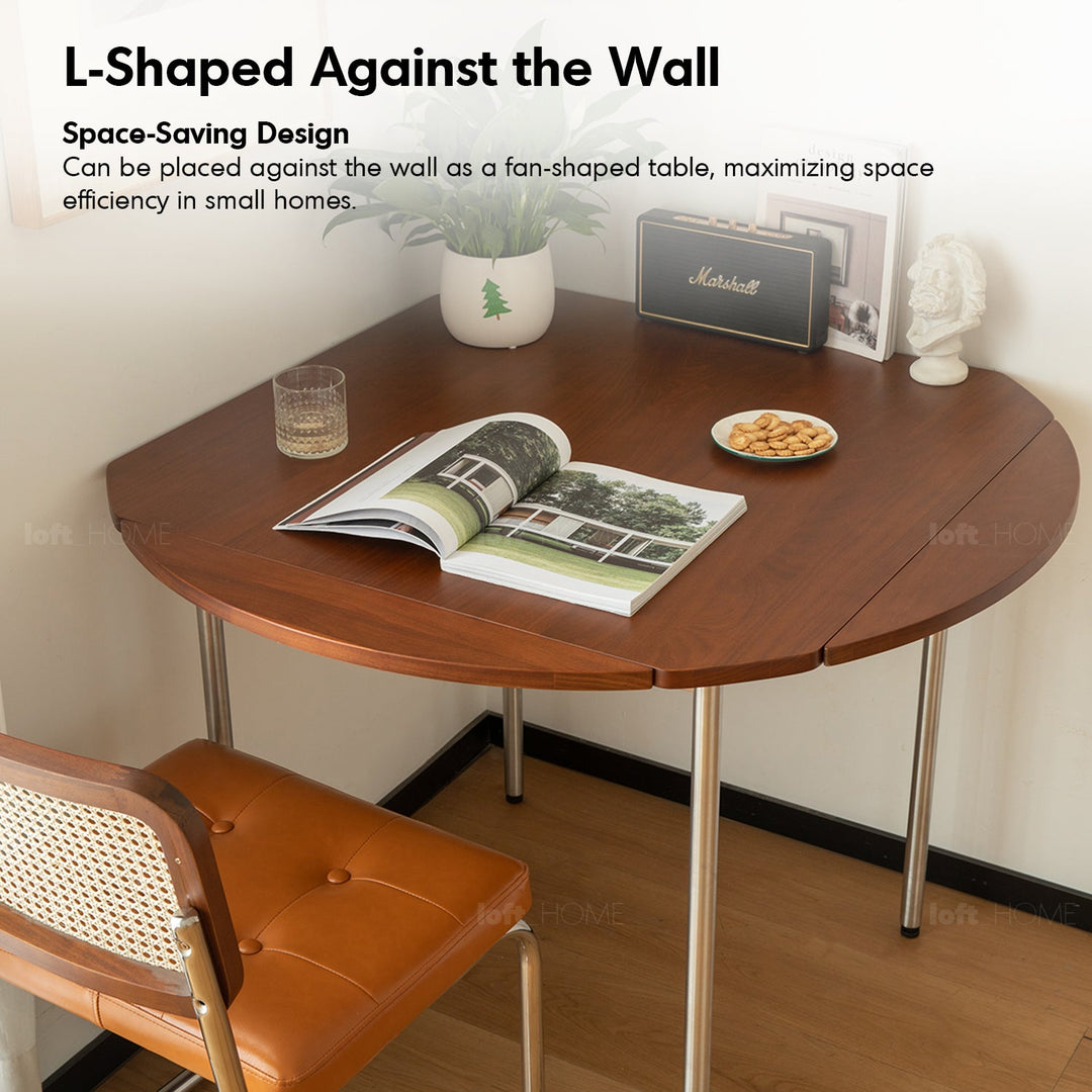 Vintage boxwood extendable round dining table season in panoramic view.