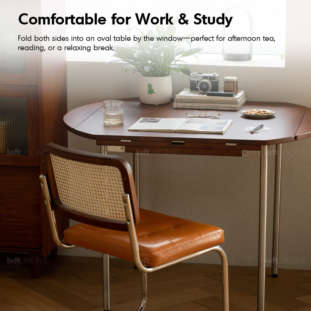 Vintage boxwood extendable round dining table season in still life.