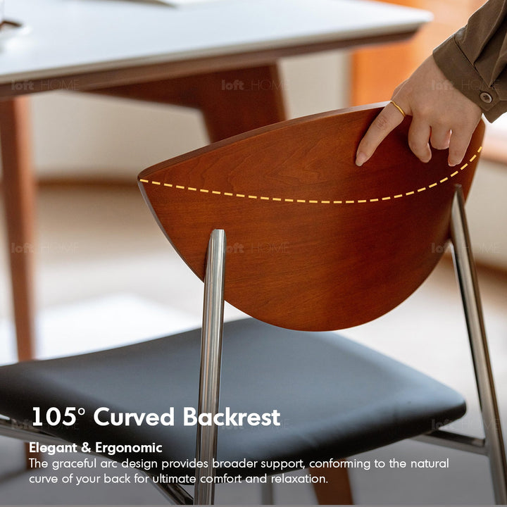 Bauhaus boxwood microfiber leather dining chair bird in close up details.