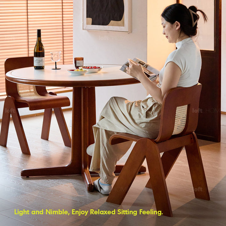 Bauhaus boxwood rattan dining chair fanko in panoramic view.