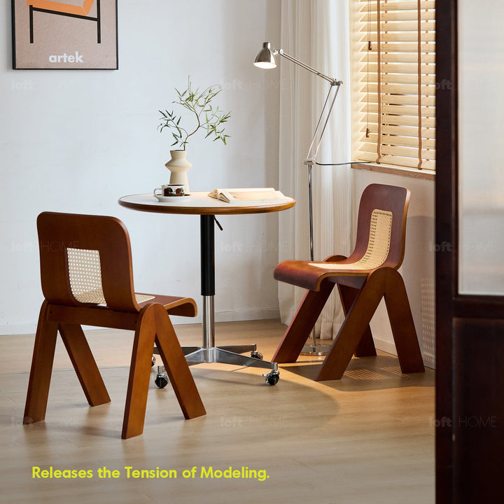 Bauhaus boxwood rattan dining chair fanko with context.