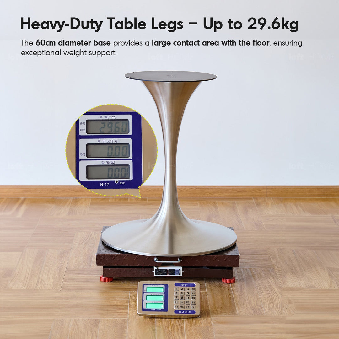 Bauhaus boxwood stainless steel round dining table tulip in close up details.