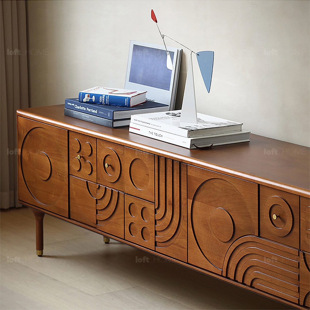 Vintage boxwood tv console madrid with context.