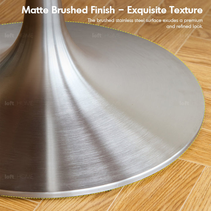 Bauhaus sintered stone stainless steel round dining table tulip in panoramic view.
