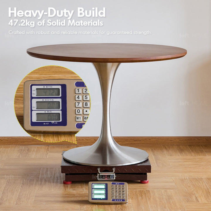Vintage sintered stone stainless steel round dining table tulip layered structure.