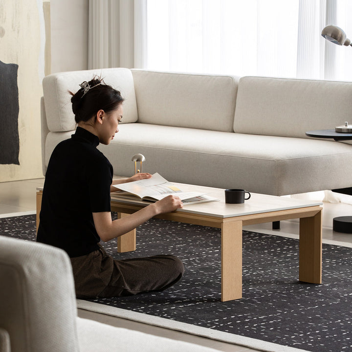 Minimalist ash wood veneer sintered stone coffee table string in real life style.