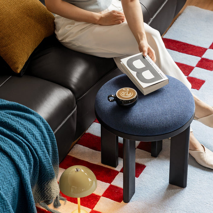 Bauhaus ash wood boucle fabric stool orbit material variants.