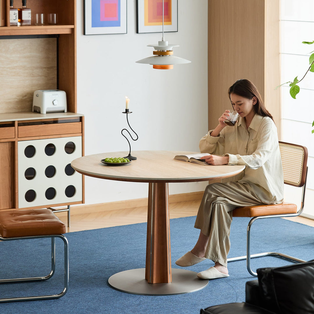 Bauhaus cherry wood sintered stone round dining table pinecone primary product view.