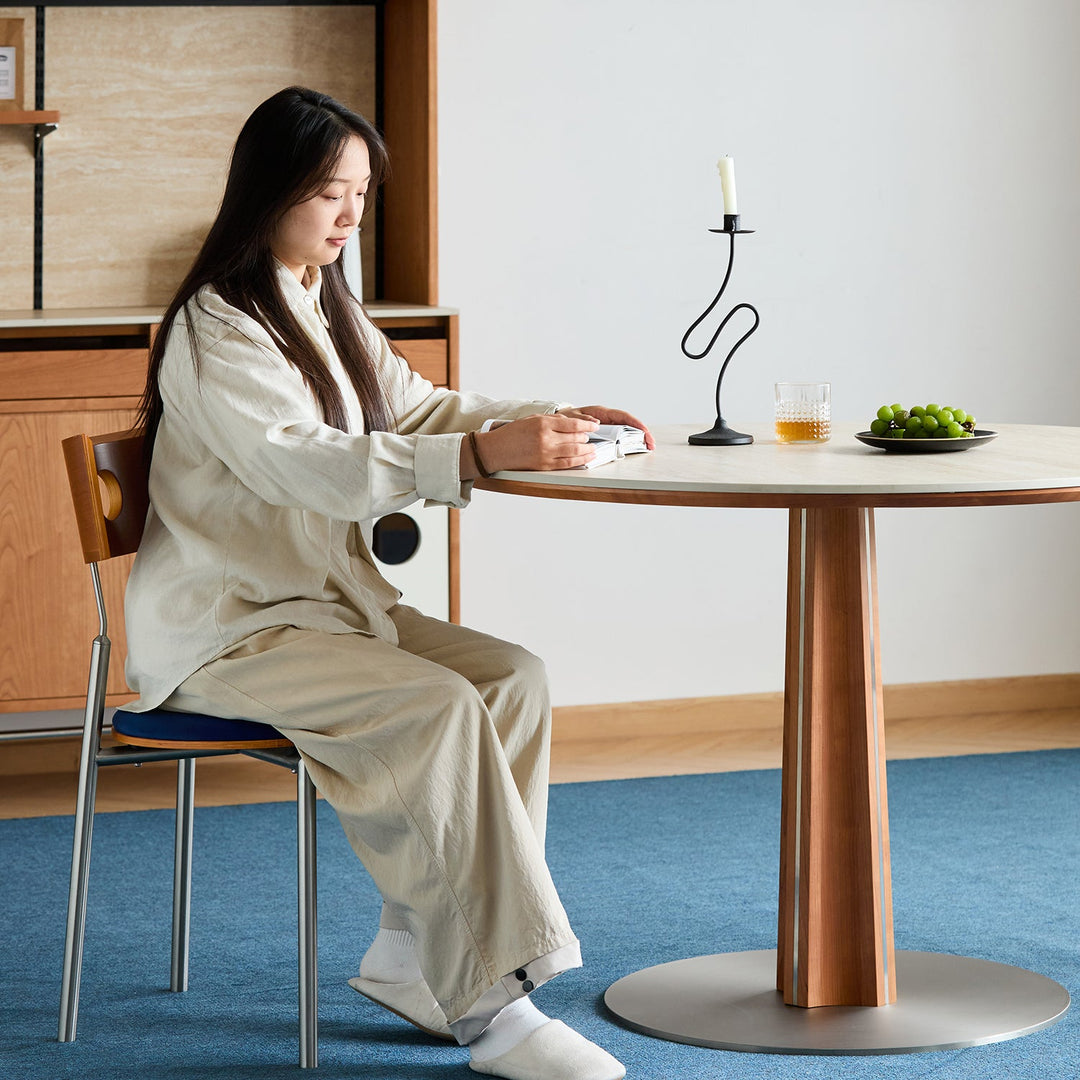 Bauhaus cherry wood sintered stone round dining table pinecone with context.