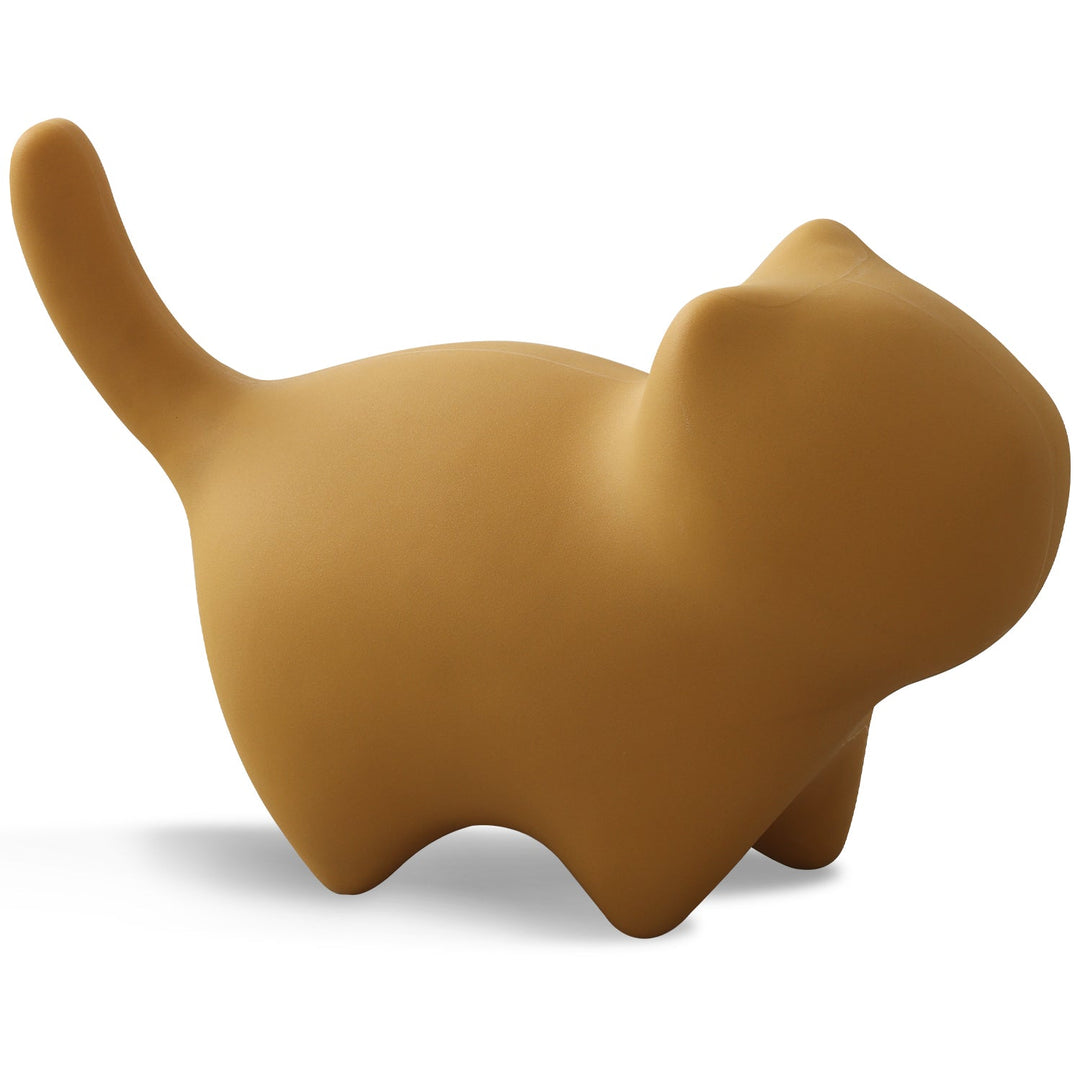 Bauhaus plastic ottoman cat in still life.