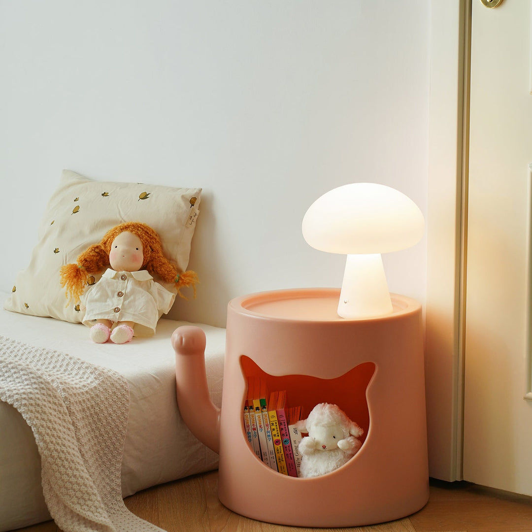 Contemporary plastic side table cat house with context.