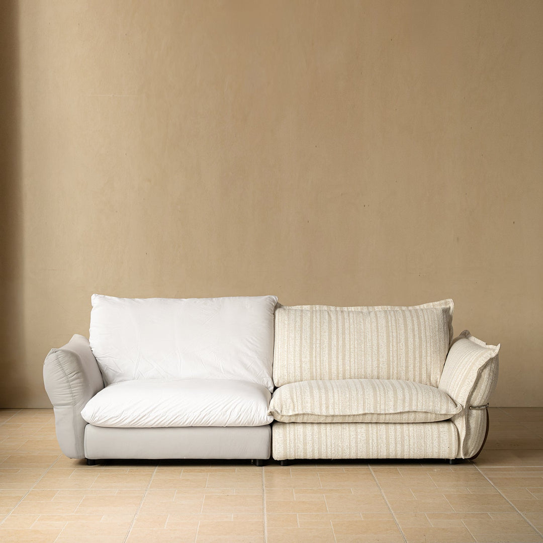 Cream boucle fabric 3 seater sofa circle in still life.