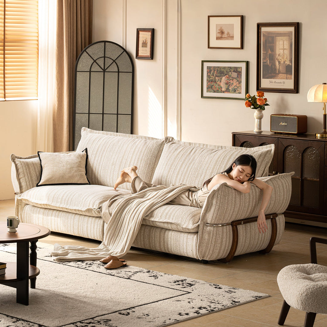 Cream boucle fabric 3 seater sofa circle in details.