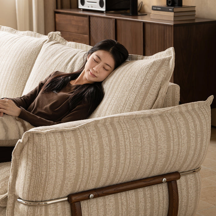 Cream boucle fabric 4 seater sofa circle with context.