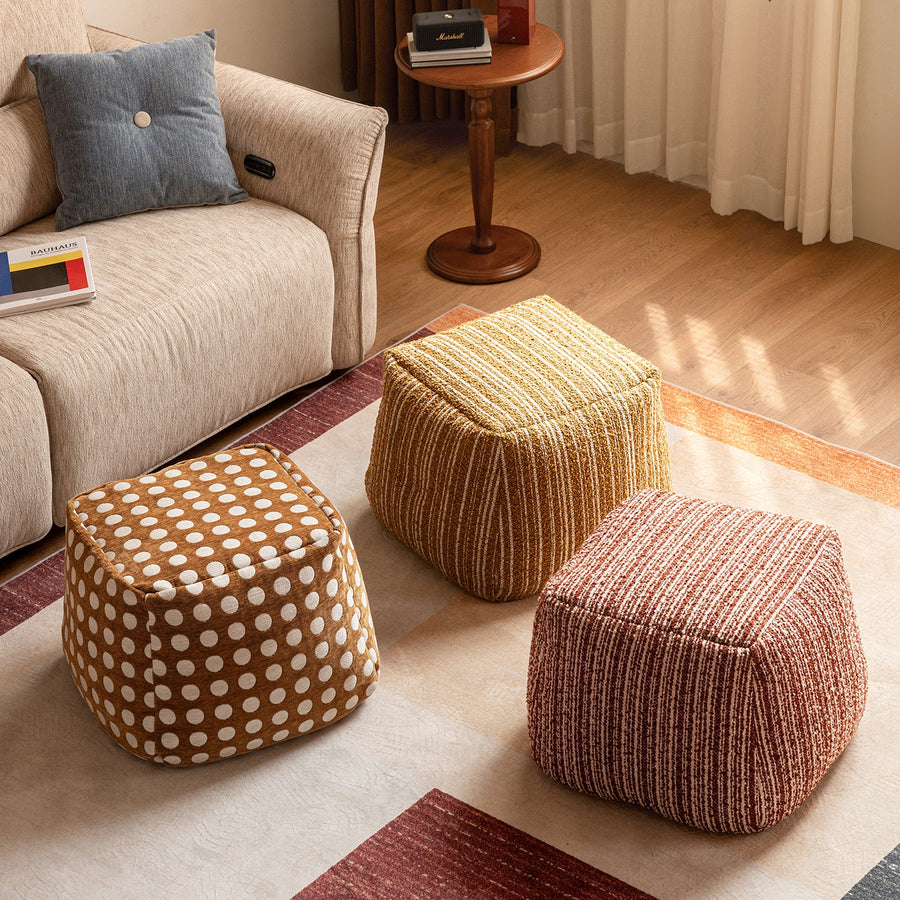 Cream boucle fabric ottoman carry primary product view.