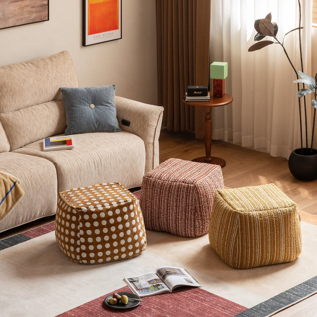 Cream boucle fabric ottoman carry in panoramic view.