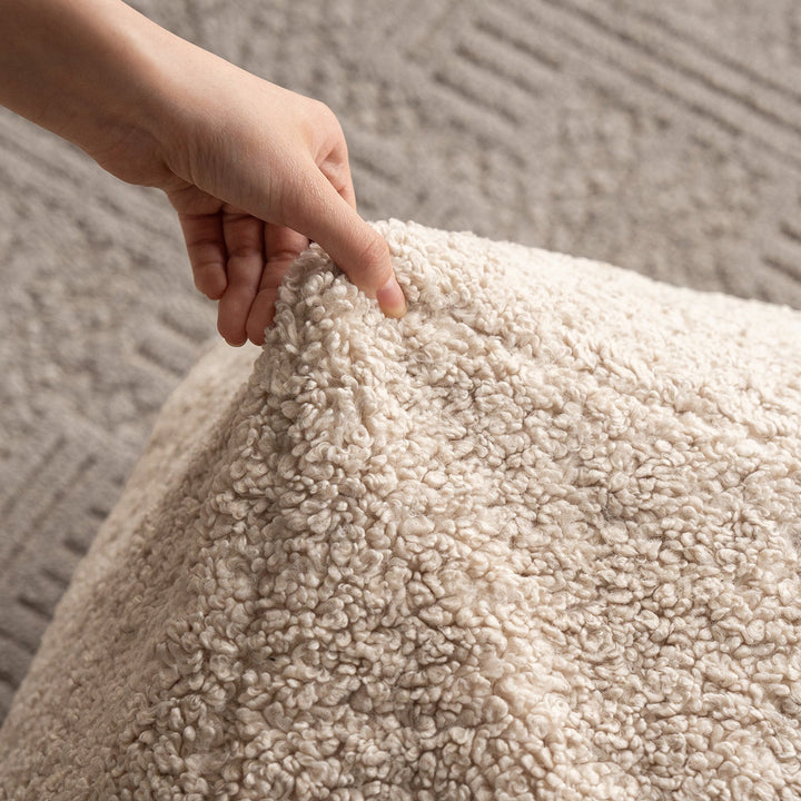 Cream boucle fabric ottoman sheep environmental situation.