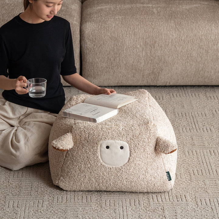 Cream boucle fabric ottoman sheep material variants.