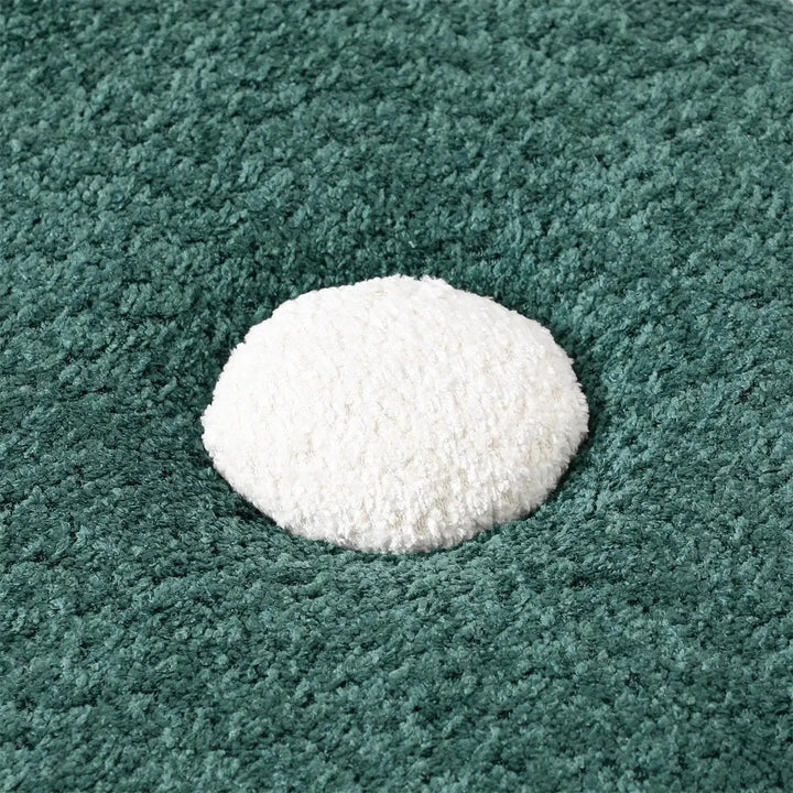 Cream boucle ottoman fish in details.
