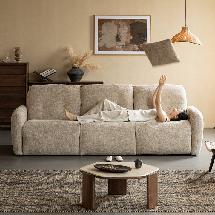 Cream chenille velvet fabric recliner 3 seater sofa mellow in close up details.