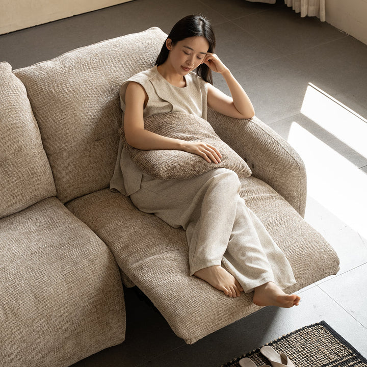 Cream chenille velvet fabric recliner 3 seater sofa mellow in still life.