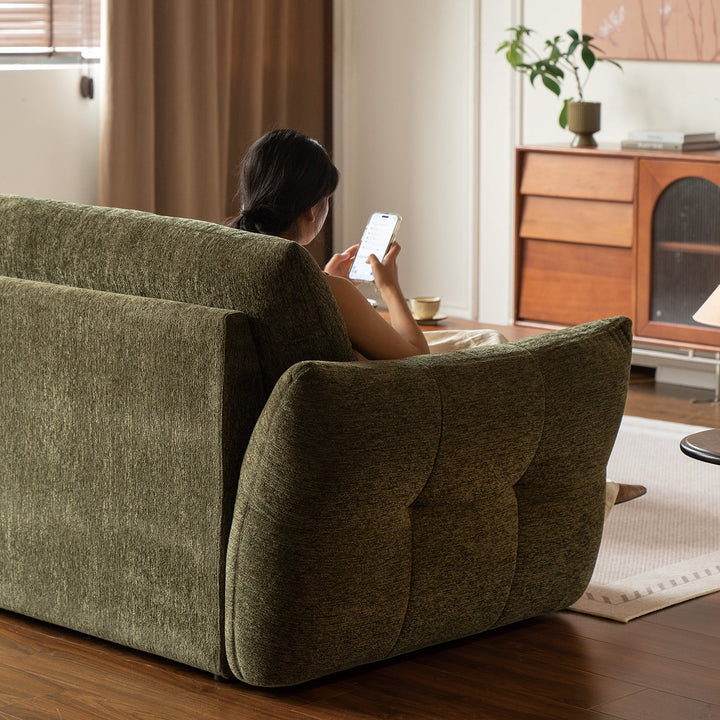 Cream fabric 3 seater sofa mochi with context.