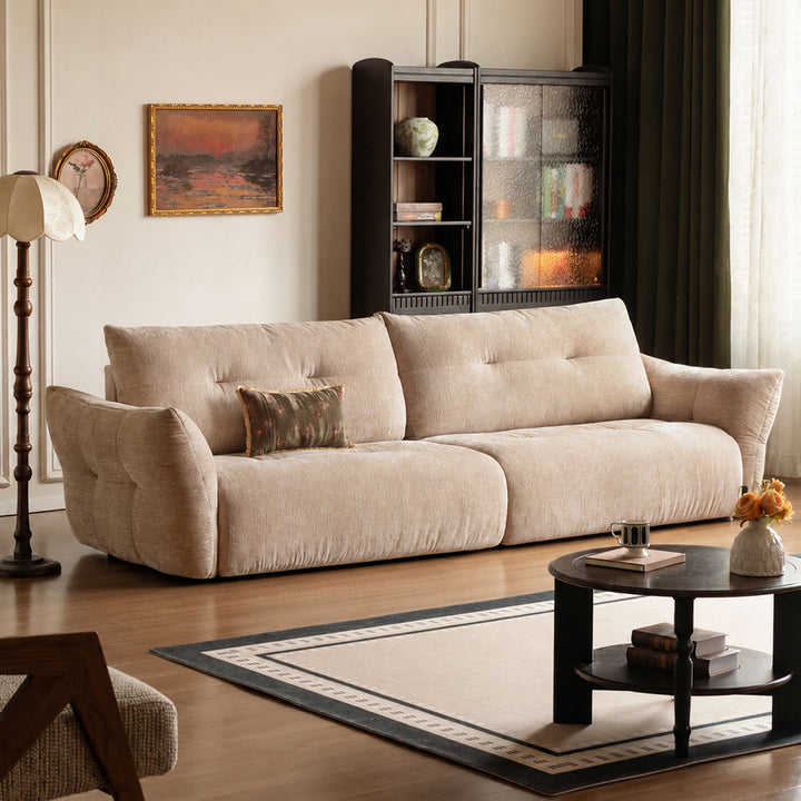 Cream fabric 4 seater sofa mochi with context.