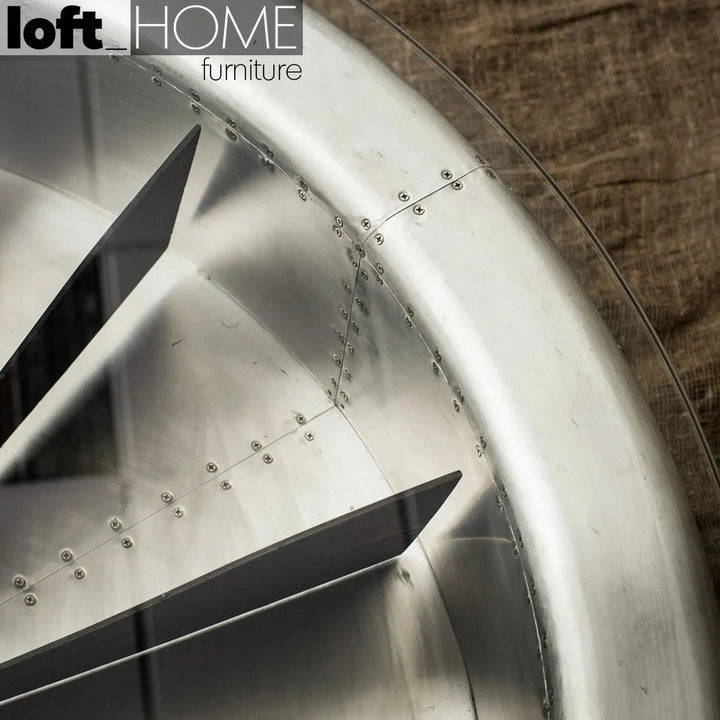 Industrial aluminium tempered glass coffee table engine in still life.