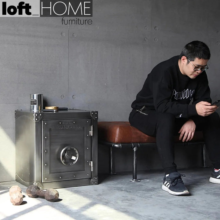 Industrial metal side table hatch wheel in real life style.