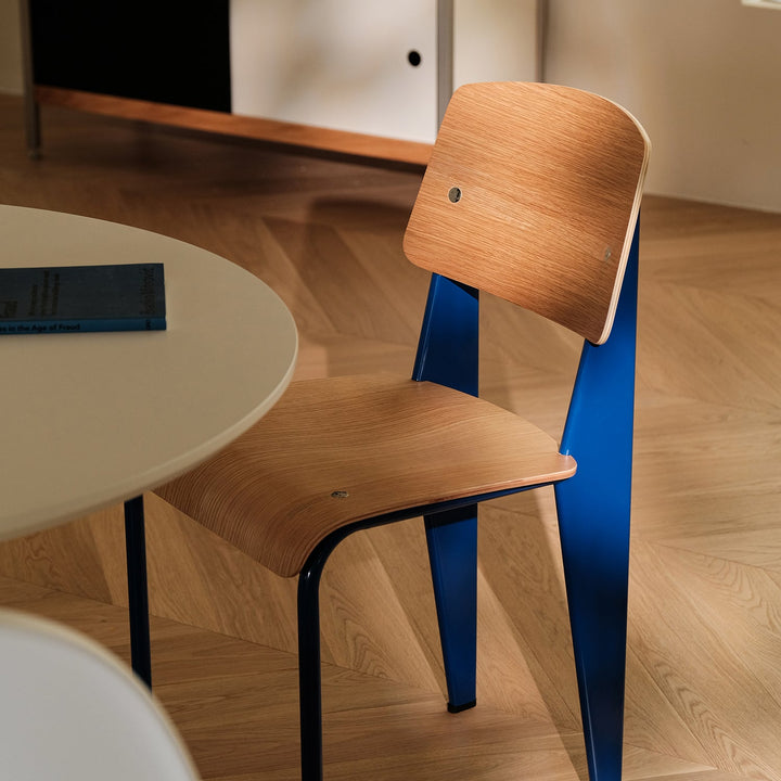 Bauhaus plywood dining chair standard with context.