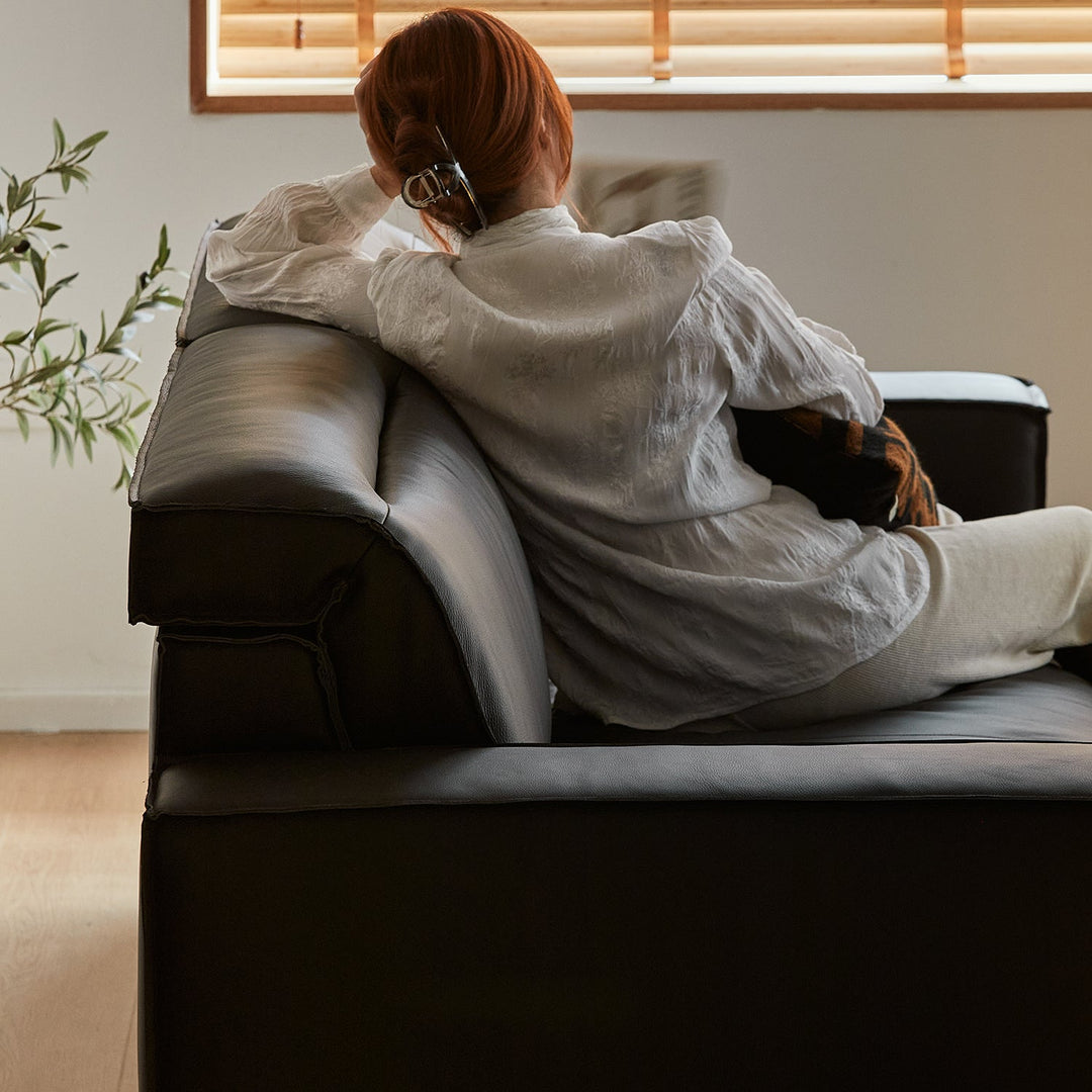 Japandi genuine leather 2 seater sofa river with context.