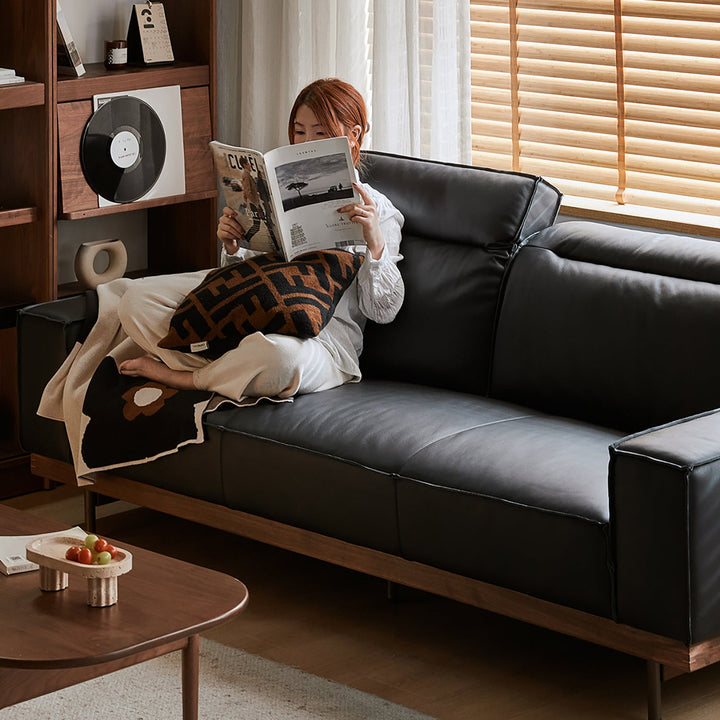 Japandi genuine leather 4 seater sofa river with context.