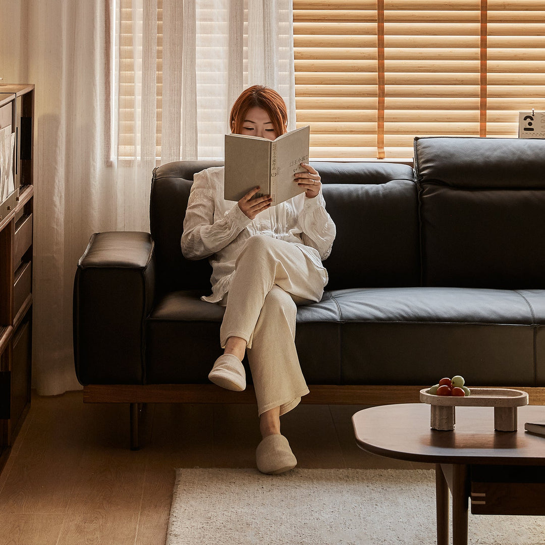 Japandi genuine leather 4 seater sofa river in still life.