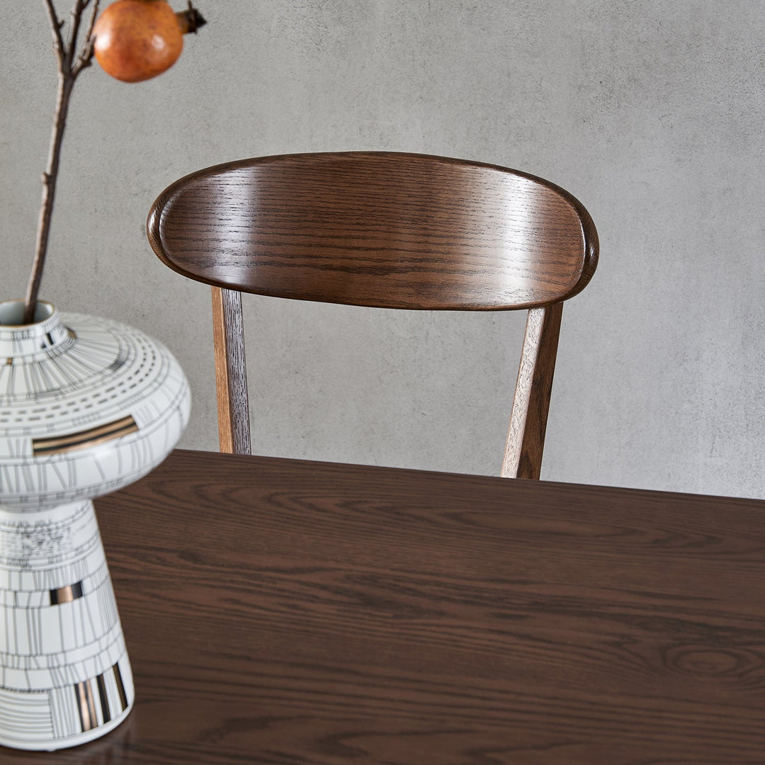 Japandi oak wood dining chair elm walnut in still life.