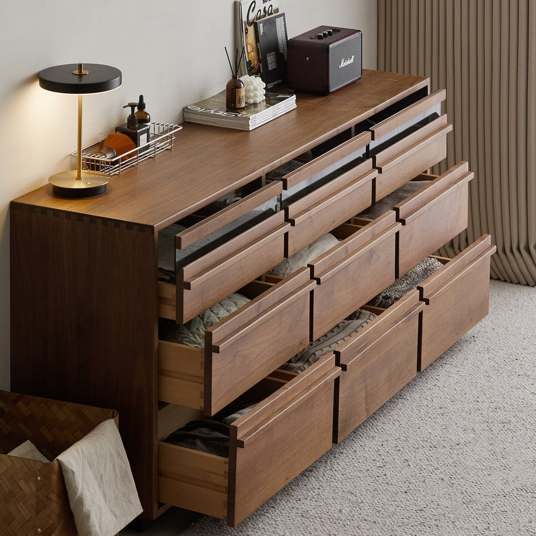 Japandi walnut wood chest of 9 drawers axis in close up details.