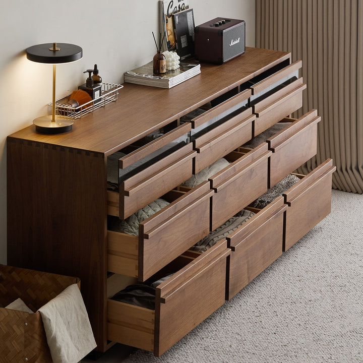 Japandi walnut wood chest of 9 drawers axis in close up details.